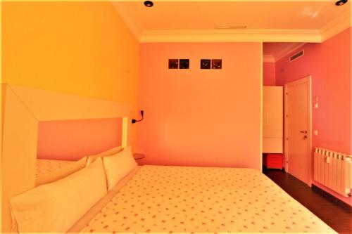 Postel nebo postele na pokoji v ubytování Hostal Arco Iris