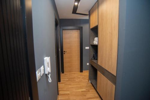 a hallway with a door leading to a room at Modern Mountain Apartman 202 in Kolašin