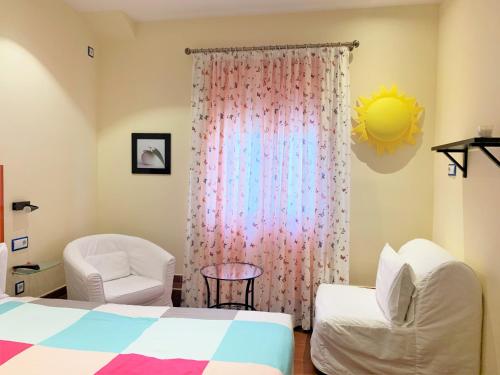 Postel nebo postele na pokoji v ubytování Hostal Arco Iris