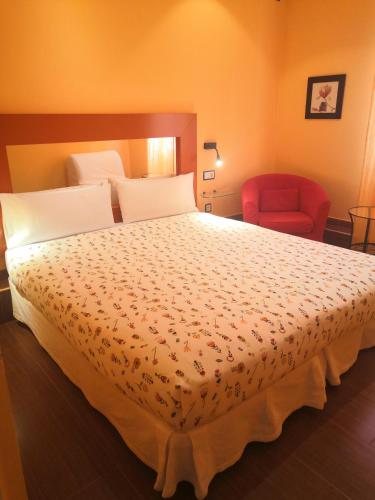Postel nebo postele na pokoji v ubytování Hostal Arco Iris