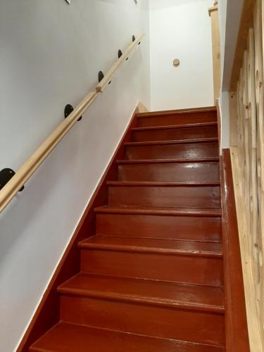 a set of stairs in a home with wood at Naproti Klínovci in Jáchymov