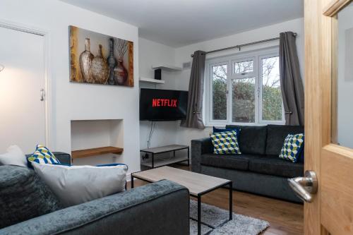 a living room with two couches and a window at Relaxation by Olauda SA - 3 Bed House with Free Parking in Bristol