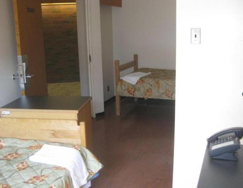 a room with a bed and a desk in a room at University of Toronto - New College Residence - Wilson Hall Residence in Toronto