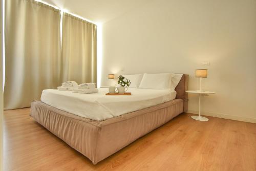Ein Bett oder Betten in einem Zimmer der Unterkunft Luxury Battisti