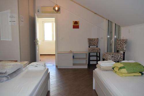 Postel nebo postele na pokoji v ubytování Apartmani BOBO