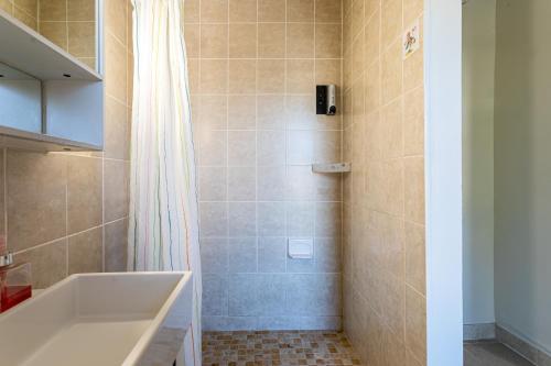 a bathroom with a tub and a shower at 1 Bus Stop To NYC-Hot Tub-EWR Airport-Free Parking in Hillside