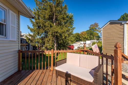 a white chair sitting on a wooden deck at 1 Bus Stop To NYC-Hot Tub-EWR Airport-Free Parking in Hillside