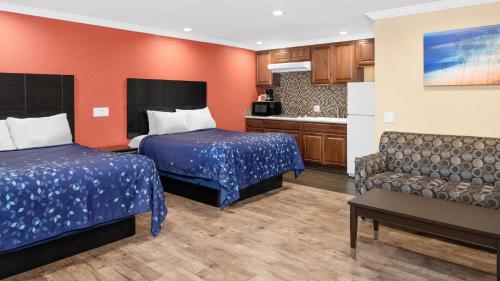 Säng eller sängar i ett rum på Scandia Motel