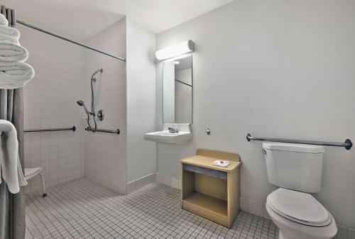 a bathroom with a toilet and a sink at Motel 6-Alamogordo, NM in Alamogordo