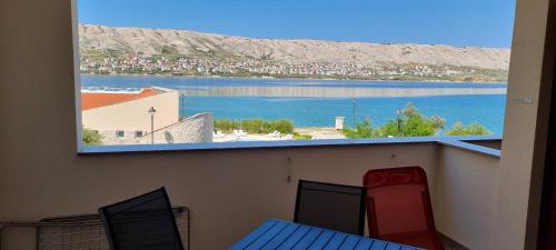 a view of a body of water from a balcony at Villa Kajgo-Pag in Pag