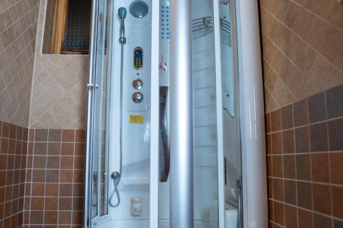a shower in a bathroom with a shower at Apartments Peggy in Jahorina
