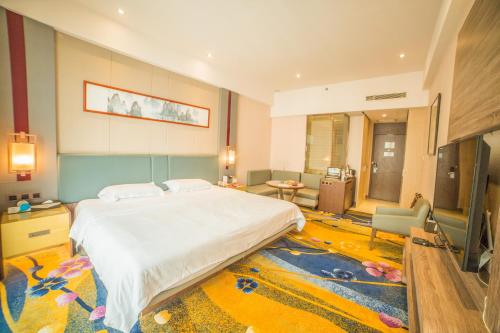 Ένα ή περισσότερα κρεβάτια σε δωμάτιο στο 济宁银座佳悦精选酒店