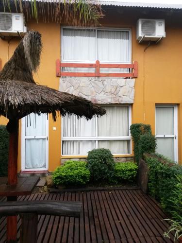 a building with windows and an umbrella in front of it at Paraiso Colon in Colón