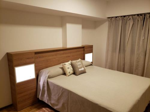 מיטה או מיטות בחדר ב-Departamento de Antonia