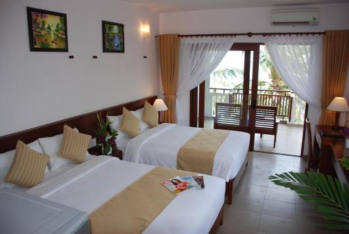 Postel nebo postele na pokoji v ubytování Canary Beach Resort