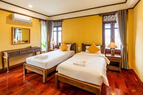 Chapulin Natural Resort tesisinde bir odada yatak veya yataklar