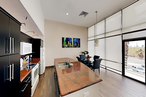 a kitchen with a table and a dining room at Sunchase IV II in South Padre Island