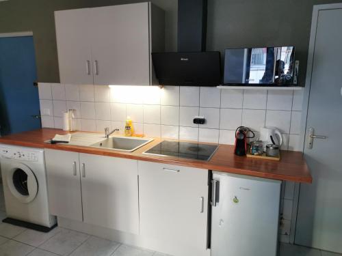 a kitchen with a sink and a counter top at studio cosy plein coeur de ville in Gap