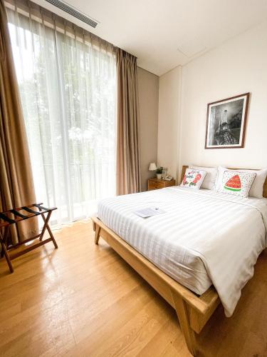 Cama o camas de una habitación en White Tree Residence