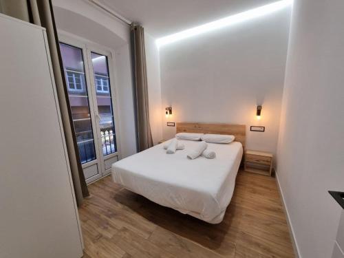 Postel nebo postele na pokoji v ubytování 119A - Espectacular apartamento en pleno centro