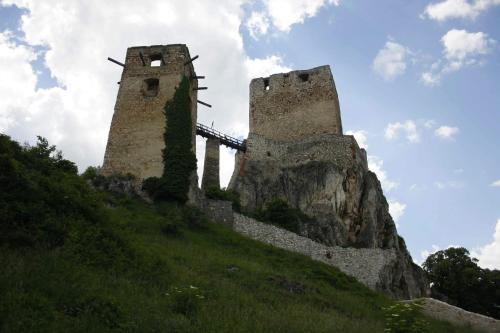 two towers on top of a grassy hill at Bakonyi Kiscsillag Bakonybél in Bakonybél