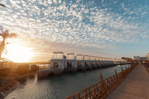 a building on a dock in the water at Bellagio Beach Resort & Spa in Hurghada