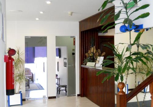 a room with a hallway with a staircase and a door at Hotel Sra da Conceicao in Praia de Mira