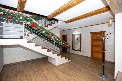 a staircase in a house with christmas decorations at Князів Двір in Bukovel