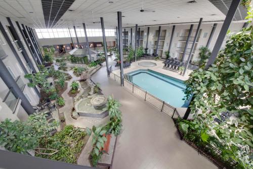 an overhead view of a building with a pool and plants at Coast Kamloops Hotel & Conference Centre in Kamloops