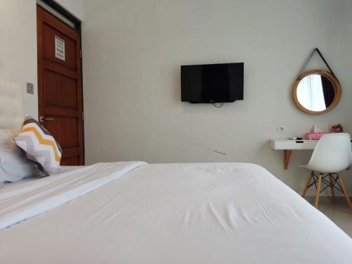 Ένα ή περισσότερα κρεβάτια σε δωμάτιο στο Alana House Syariah