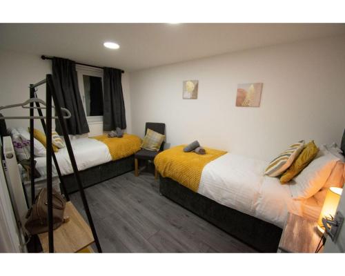 Ένα ή περισσότερα κρεβάτια σε δωμάτιο στο Ideal Lodgings in Baxenden