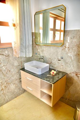 Vannituba majutusasutuses La Petite Maison and Sea Splash