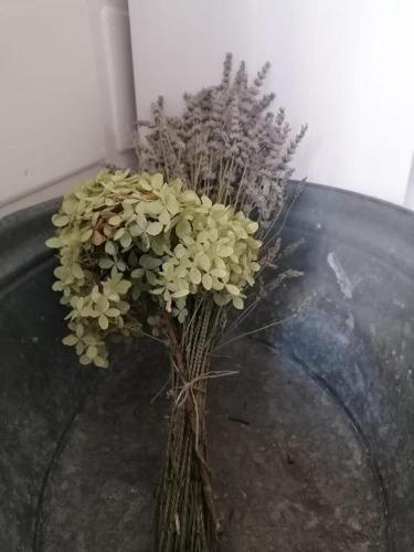 a vase filled with flowers on top of a table at B&B Sotto le Mura in Bergamo