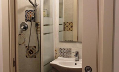 a bathroom with a sink and a shower at B&B Al Viale in Macerata