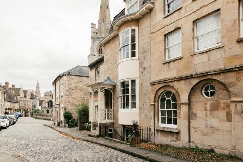 a street in an old town with buildings at Crown Hotel in Stamford