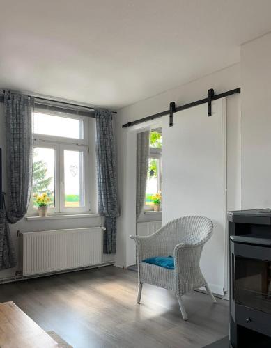 Posezení v ubytování Vierseitenhof Hasenfelde - Ferienwohnung Feldblick