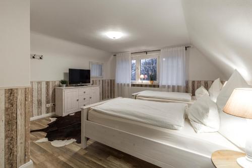 Ένα ή περισσότερα κρεβάτια σε δωμάτιο στο Ferienhaus - Dorfperle Borstel