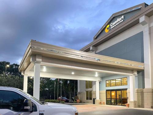 a store with a car parked in front of it at Comfort Inn & Suites Sarasota I75 in Sarasota