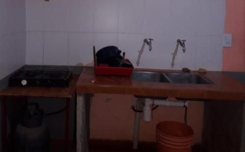 a kitchen with a sink and a counter top at ALOJAMIENTO SANTY in Iruya