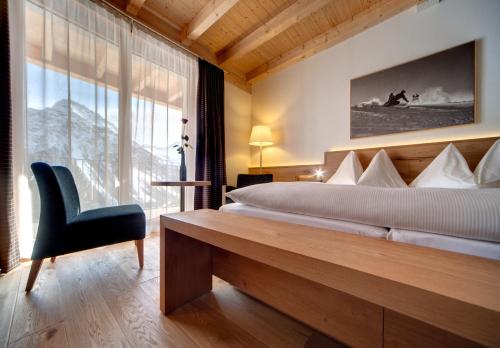Postel nebo postele na pokoji v ubytování Waldhotel Arosa