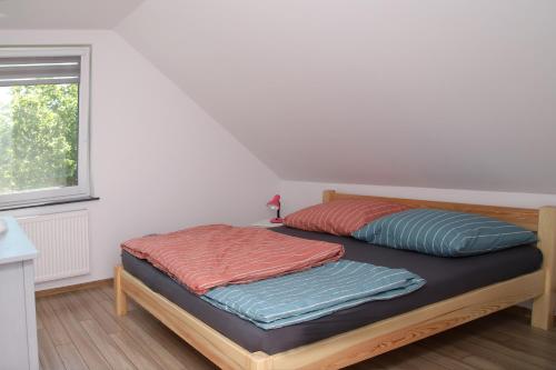 Krevet ili kreveti u jedinici u okviru objekta Bolek Lolek Domki Apartamenty