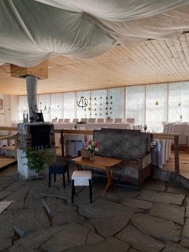 a living room with a couch and a table at Chinova Mötesgård i Järvsö in Järvsö