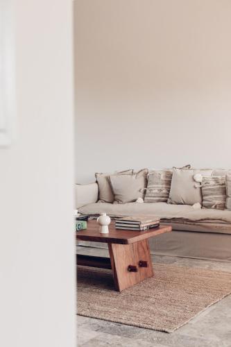 a living room with a couch and a coffee table at Teruar Urla in Urla