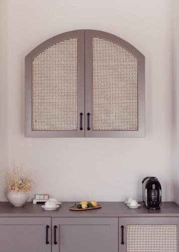 a kitchen with a counter top with two cupboards at Teruar Urla in Urla