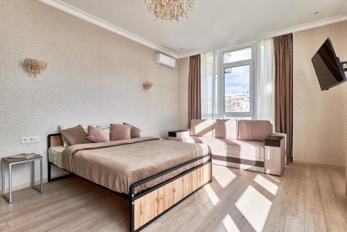 Letto o letti in una camera di KADOR HOME HOTEL downtown