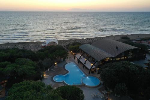 an aerial view of a resort with a swimming pool at Canado Club Family Village in Marina di Castagneto Carducci