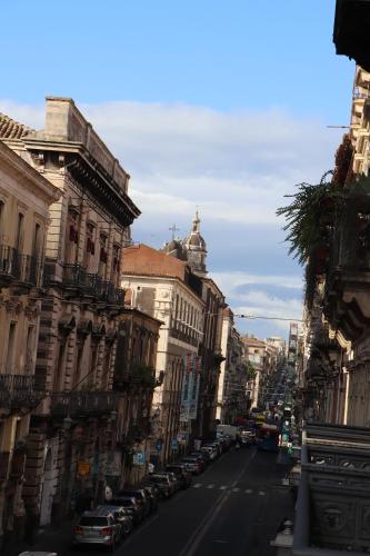 a view of a city street with buildings and cars at DOMUS IOLE appartamento nel centro storico in Catania