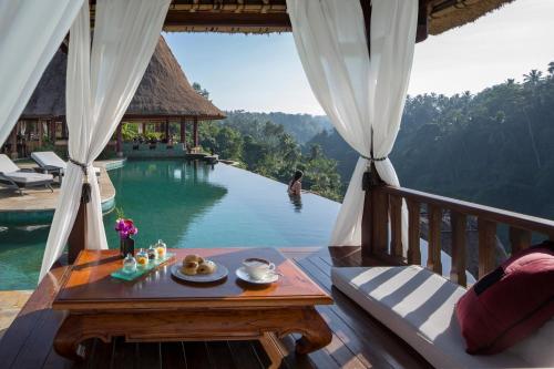 a balcony of a resort with a view of a pool at Viceroy Bali in Ubud