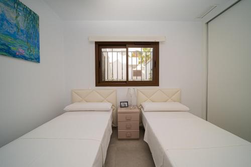 A bed or beds in a room at Linara