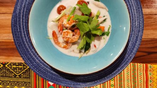 a blue plate of food with shrimp and greens at Zama Resort Koh Phangan in Haad Chao Phao